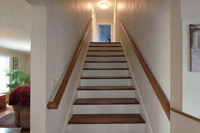 The same staircase before the edit, with a full-length left handrail